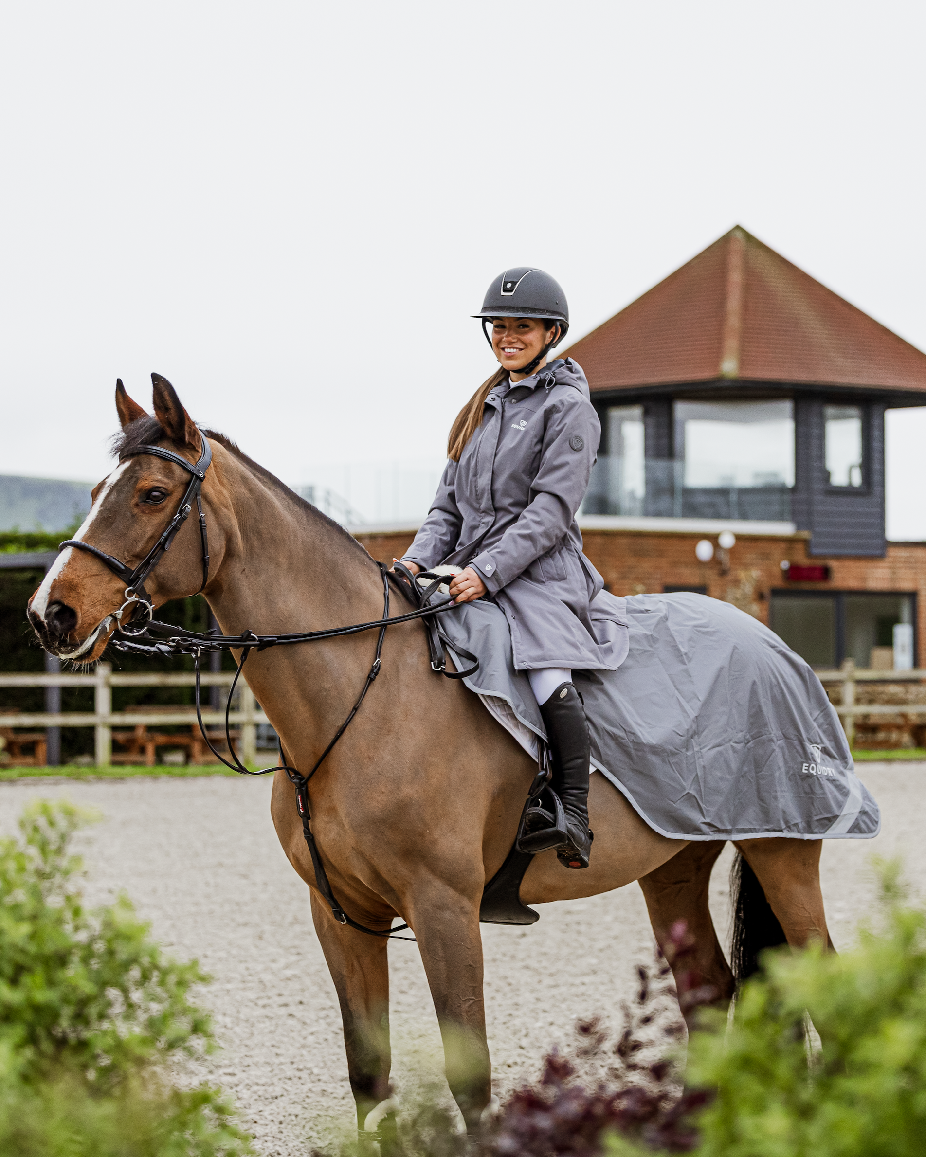 Horse and rider wearing grey Equidry waterproof exercise sheet from Equiflair.