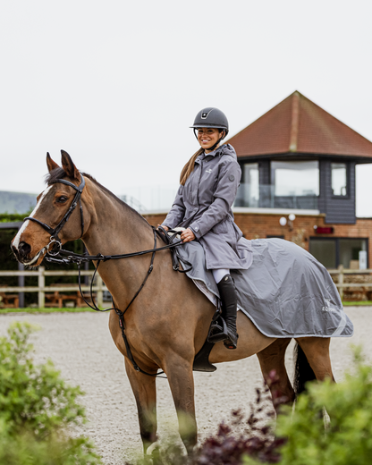 Horse and rider wearing grey Equidry waterproof exercise sheet from Equiflair.