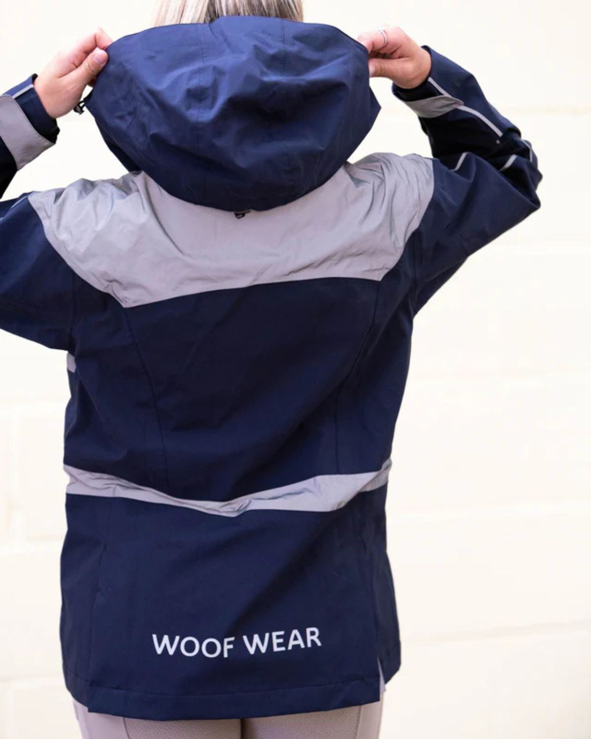 Woof Wear All Season Riding Jacket Navy: Waterproof equestrian jacket for women, with hood and reflective detail, from Equiflair.