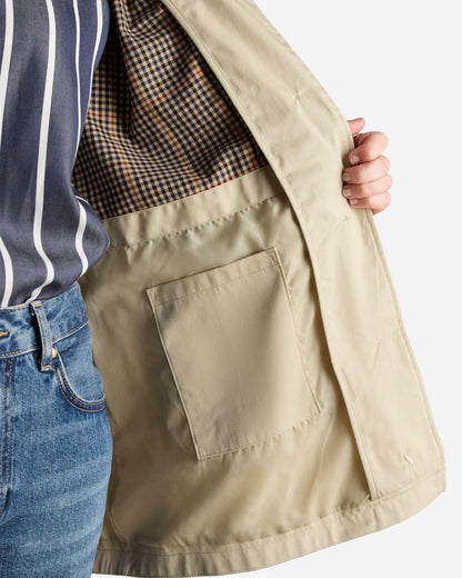 JOULES RAINMORE Neutral Waterproof Raincoat with Button Through Design and Checked Lining Detail - Shop Now