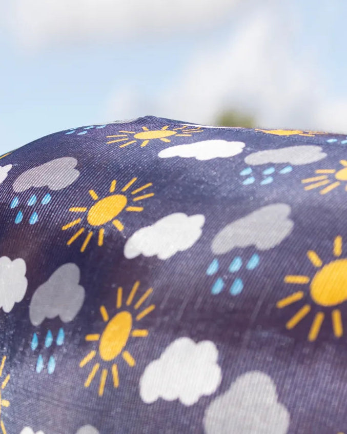StormX horse fly rug with fun weather print: sun, clouds, rain. Keeps bugs away! Equiflair's navy, blue, yellow original.