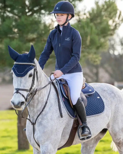 Horse Riding: Young Equestrian on Grey Horse with Lemieux Navy Pad. Equiflair