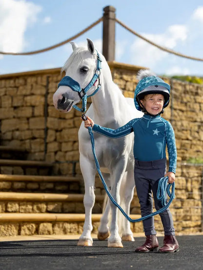 Child in LeMieux Riding Gear with Pony. Mini Base Layer Marine. Equiflair