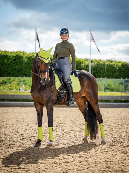 Equestrian Elegance: LEMIEUX Suede Dressage Square KIWI on Horseback | Stylish Horse Riding Gear