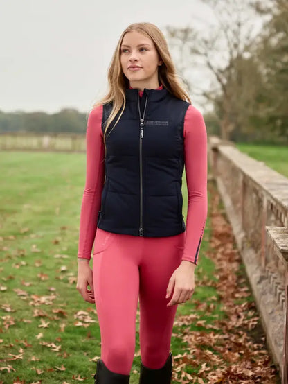 Lemieux Young Rider Pammy Training Gilet Navy - Equiflair: Stylish girl in riding attire, navy vest.