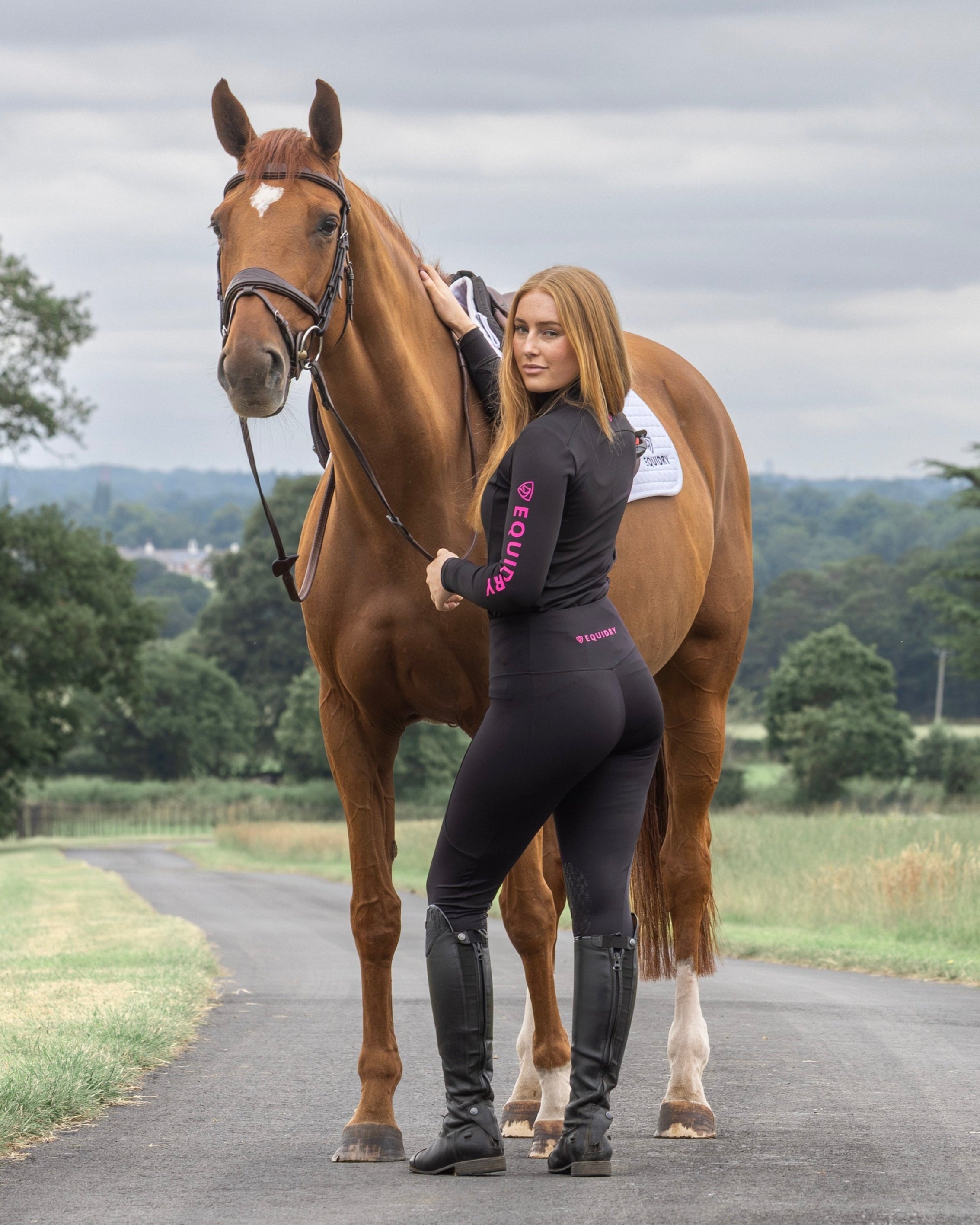 Equestrian Lifestyle: Woman & Horse Posing. Equidry Riding Leggings. Water-Repellent Black/Pink. #EquestrianFashion #HorseRiding