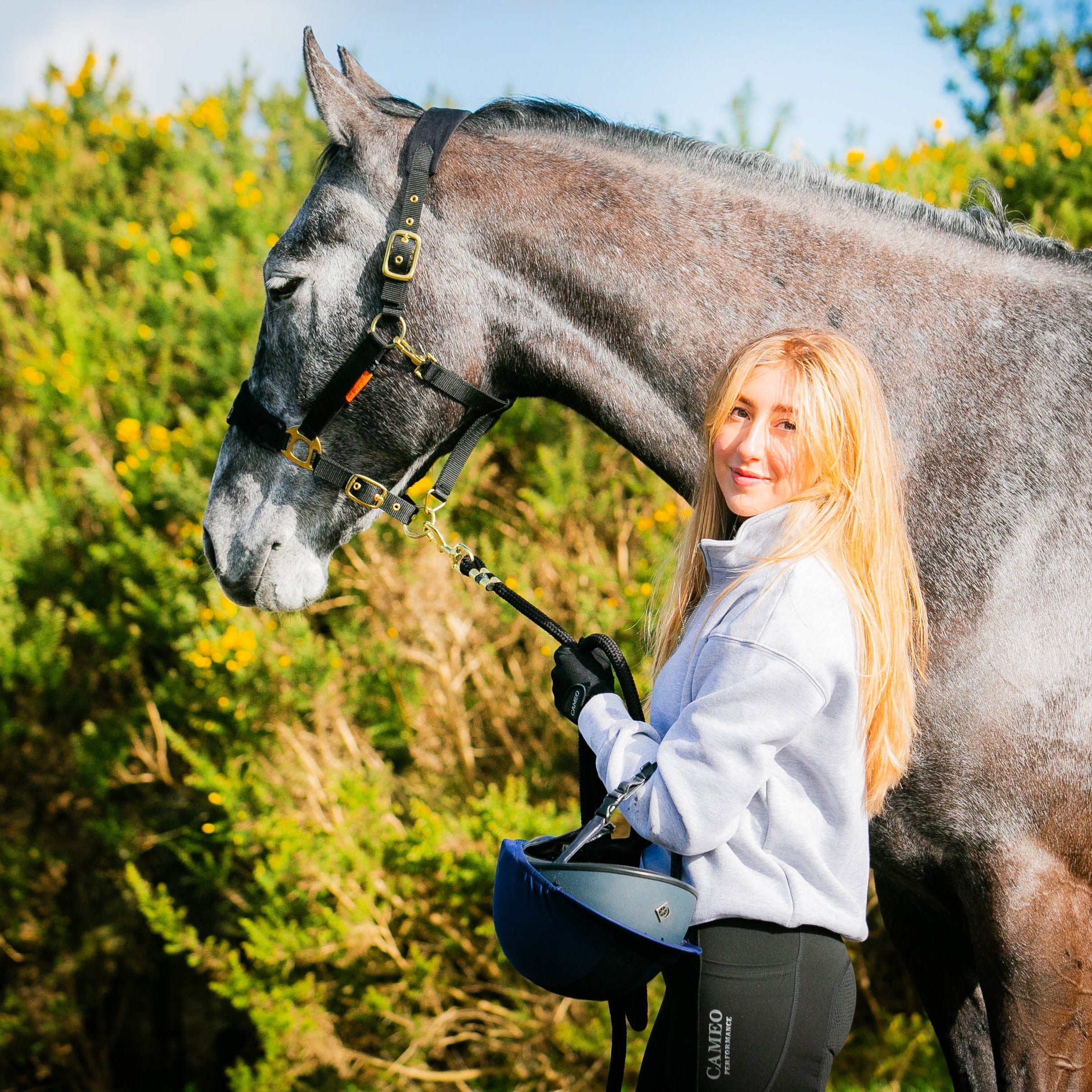 Equestrian Woman with Horse Wearing Grey Cameo Mid Layer Sweatshirt from Equiflair | Horse Riding Apparel