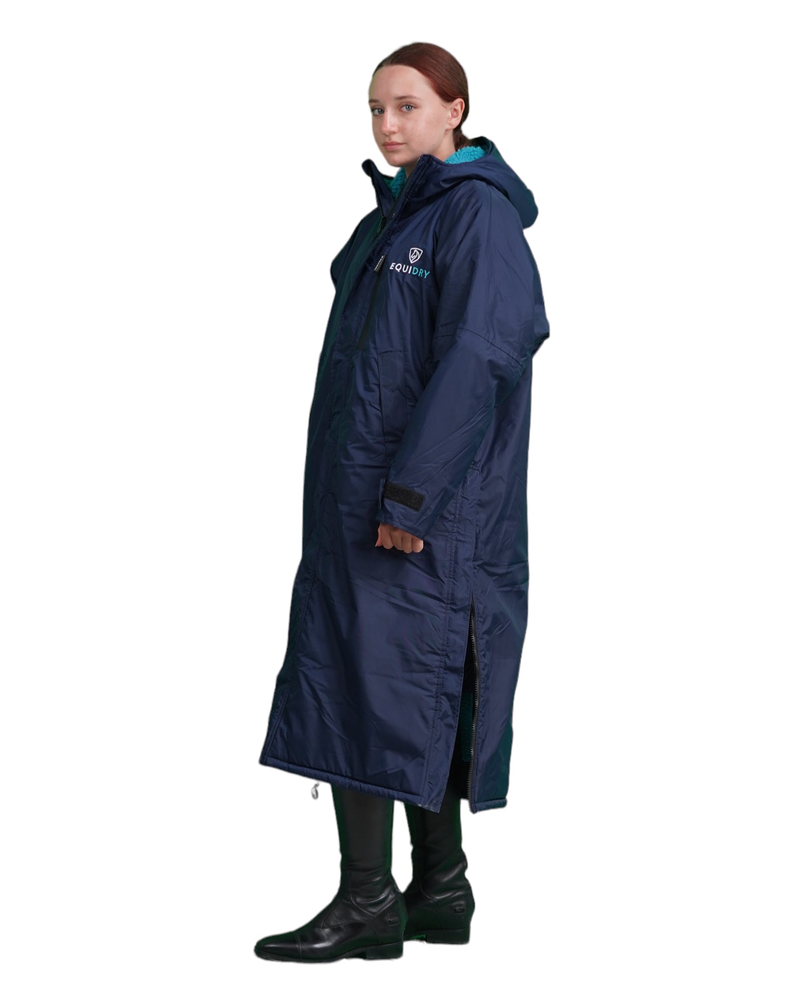 EQUIDRY women's long waterproof horse riding coat in Navy/Turquoise studio side on showing side zips 