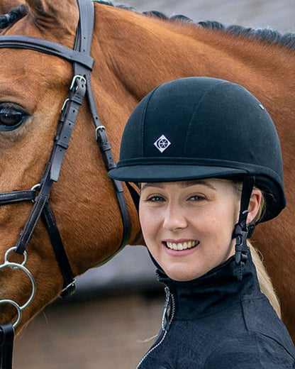 Girl in Charles Owen YR8 Junior Navy Riding Helmet with Horse - Equestrian Safety