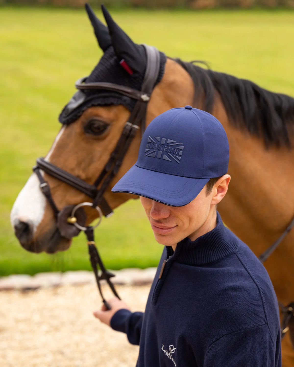 LEMIEUX Union Jack Baseball Cap in Navy worn by man next to a horse. Equestrian Style from Equiflair Store.