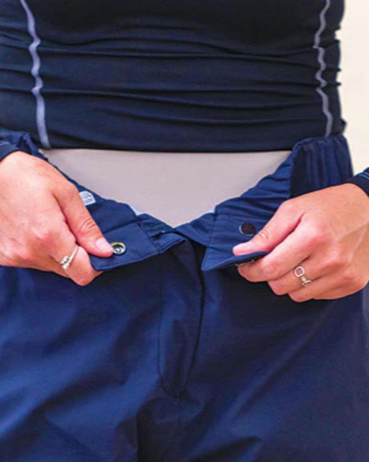 Woof Wear Waterproof Riding Trousers being fastened. Equestrian Apparel.