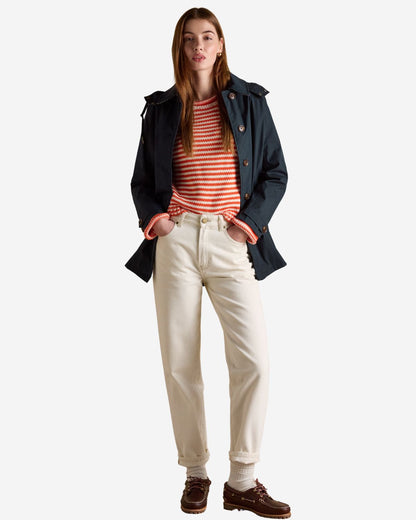 Joules Navy Waterproof Raincoat with Striped Sweater, Beige Jeans and Brown Boat Shoes. Equiflair Fashion.