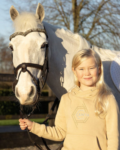 COLDSTREAM X ANYA Diamante Hoodie Champagne with young equestrian & horse. Equiflair equestrian apparel.