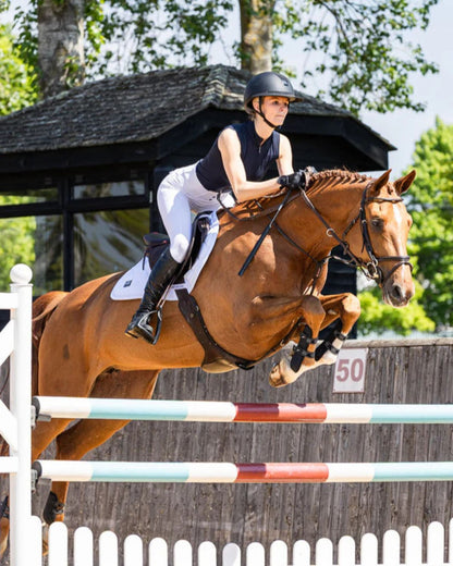 Equestrian Jumping: Woof Wear Navy Sleeveless Tech Riding Shirt. Horse & Rider in Action!