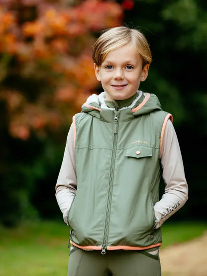 LeMieux Mini George Gilet Rosemary: Child in equestrian outerwear with sherpa fleece lining. Warm & stylish for outdoor play!