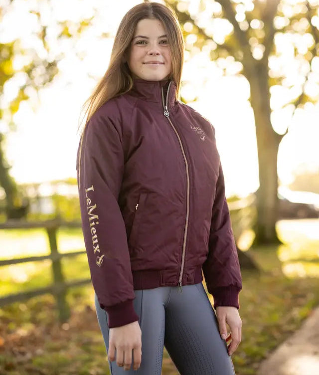 LEMIEUX Young Rider Elite Team Jacket in Burgundy. Girl in Waterproof Wind Resistant Equestrian Jacket. Equiflair.