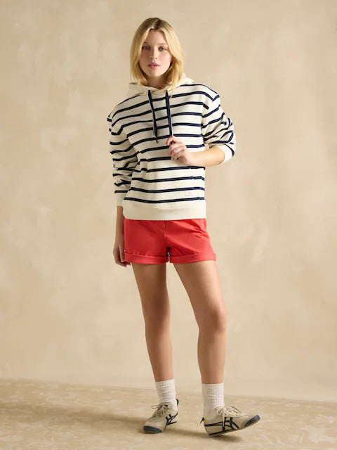 Woman in Cream & Navy Striped Hoodie and Red Shorts. Shop Women's Fashion at Equiflair Saddlery.