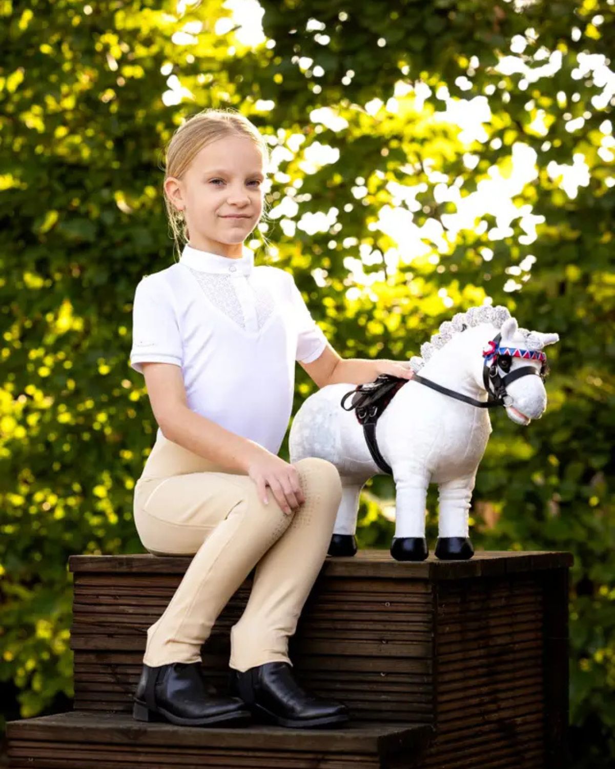 Girl in Riding Attire with LEMIEUX TOY PONY COCO. Equestrian Lifestyle