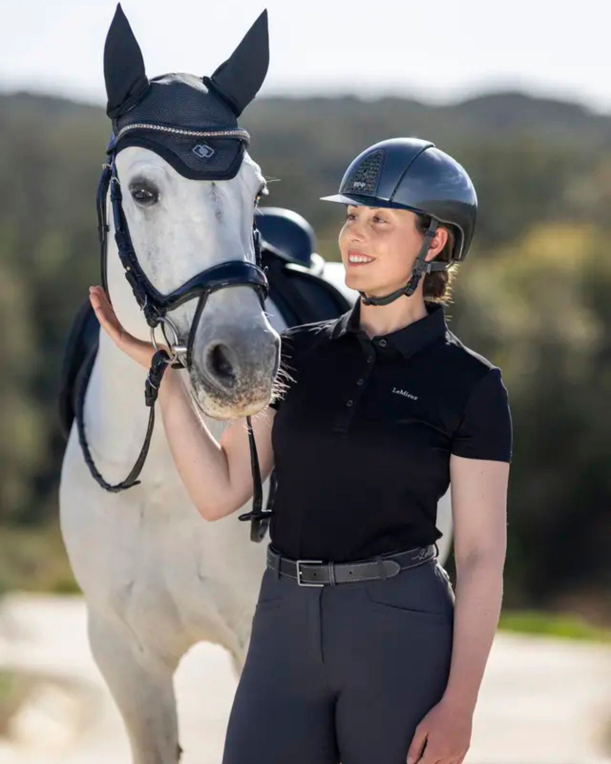 Woman with Horse wearing LeMieux Ultra Mesh Fly Hood Black from Equiflair - Equestrian Gear