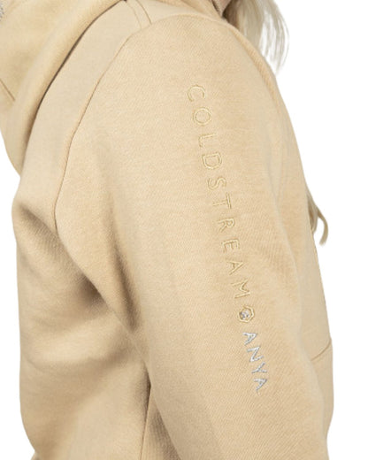COLDSTREAM X ANYA Diamante Hoodie Champagne Equestrian Activewear - Close up on Arm with Logo