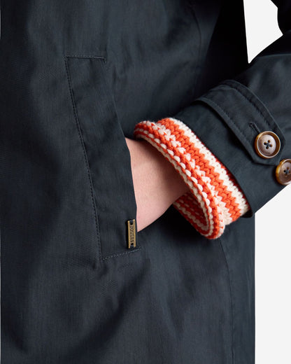 Joules Rainmore Navy Waterproof Raincoat with Hand in Pocket Showing Knitted Cuff Detail, Button Closures