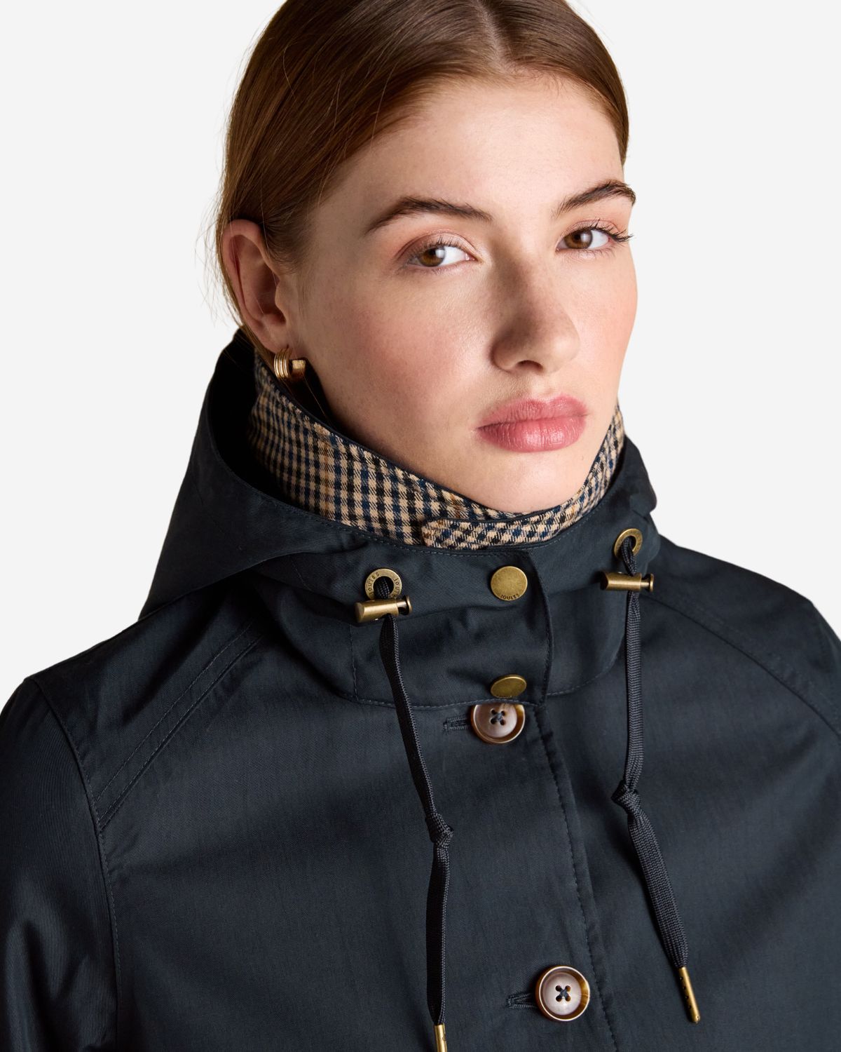 JOULES RAINMORE NAVY WATERPROOF RAINCOAT: Close up of woman in Joules rain jacket. Stay dry in style!