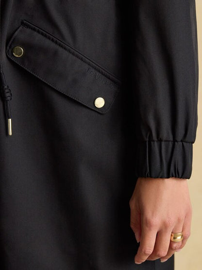 JOULES Black Waterproof Coat with Hood - Pocket detail of stylish and functional rainwear.
