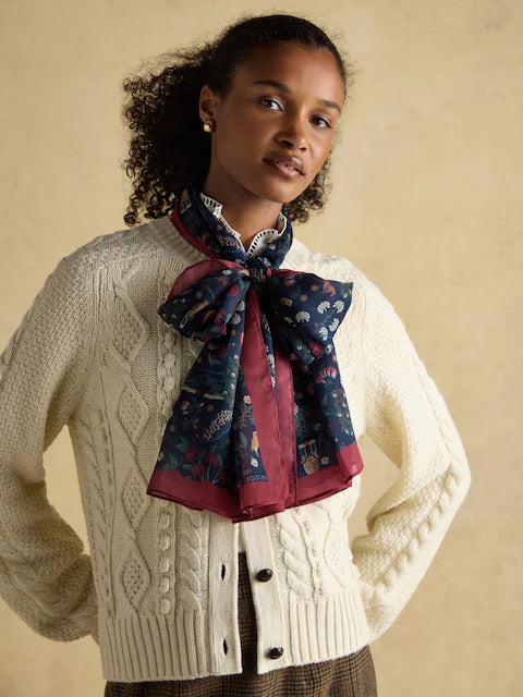 Woman wearing JOULES ABBERTON navy printed scarf. Lightweight fashion scarf.