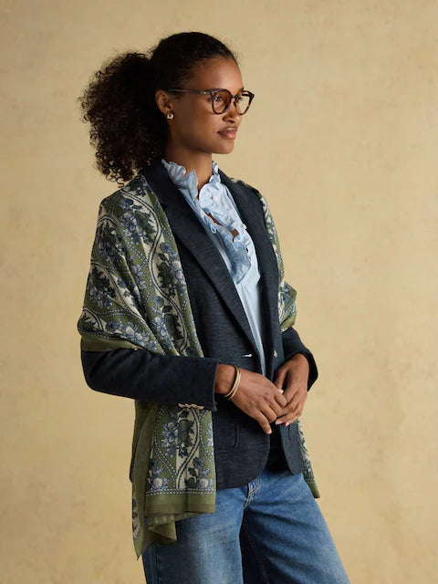 Joules Abberton Khaki Green Printed Scarf, lightweight, worn with blazer and blouse by woman with glasses. Equiflair Saddlery