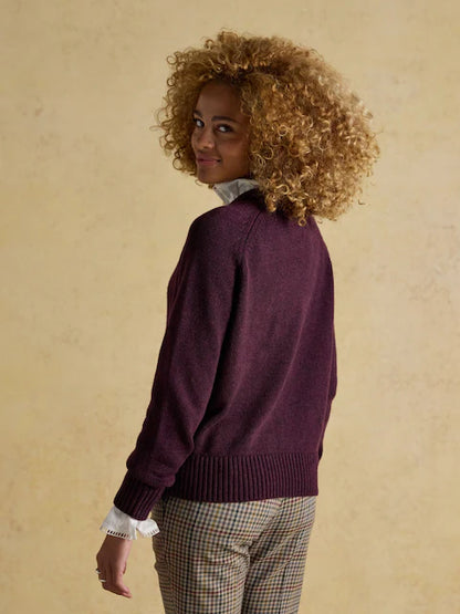 Joules Jonty wine red crew neck jumper from Equiflair Saddlery. Woman in sweater, burgundy top, curly hair, fashion