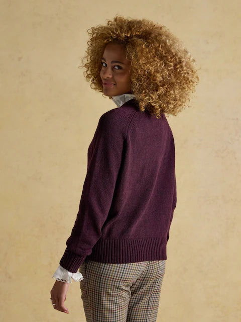 Joules Jonty wine red crew neck jumper from Equiflair Saddlery. Woman in sweater, burgundy top, curly hair, fashion
