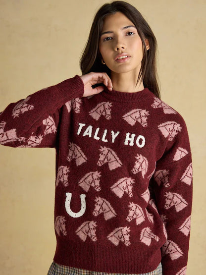Joules Tally Ho Horse Sweater: Woman in burgundy knit jumper with horse pattern & horseshoe. Shop equestrian style!