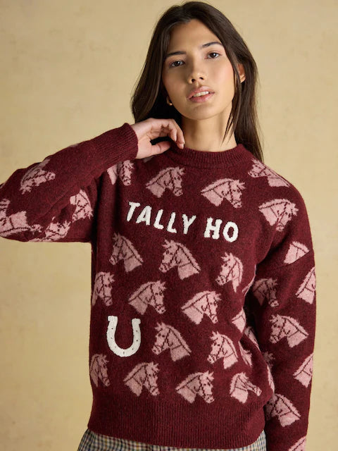 Joules Tally Ho Horse Sweater: Woman in burgundy knit jumper with horse pattern & horseshoe. Shop equestrian style!