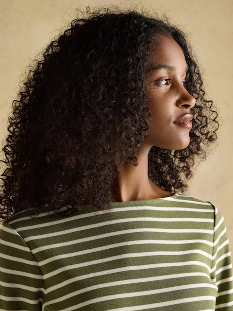 Joules Harbour Green Stripe Breton Top: Woman wearing relaxed fit, boat neck cotton striped shirt. Classic nautical style from Equiflair.