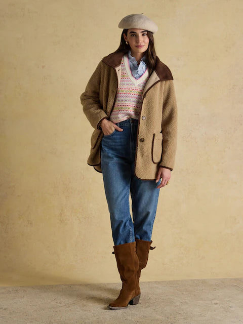 JOULES Sadie Taupe Longline Fleece Jacket. Woman wearing stylish borg coat with corduroy collar and jeans.