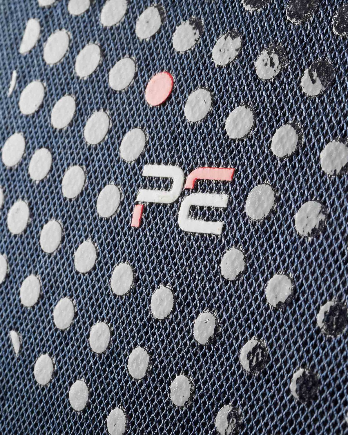 Premier Equine Anti-Slip Dressage Square - Navy. Close-up of fabric with logo, anti-slip dots, and Airtechnology detail.