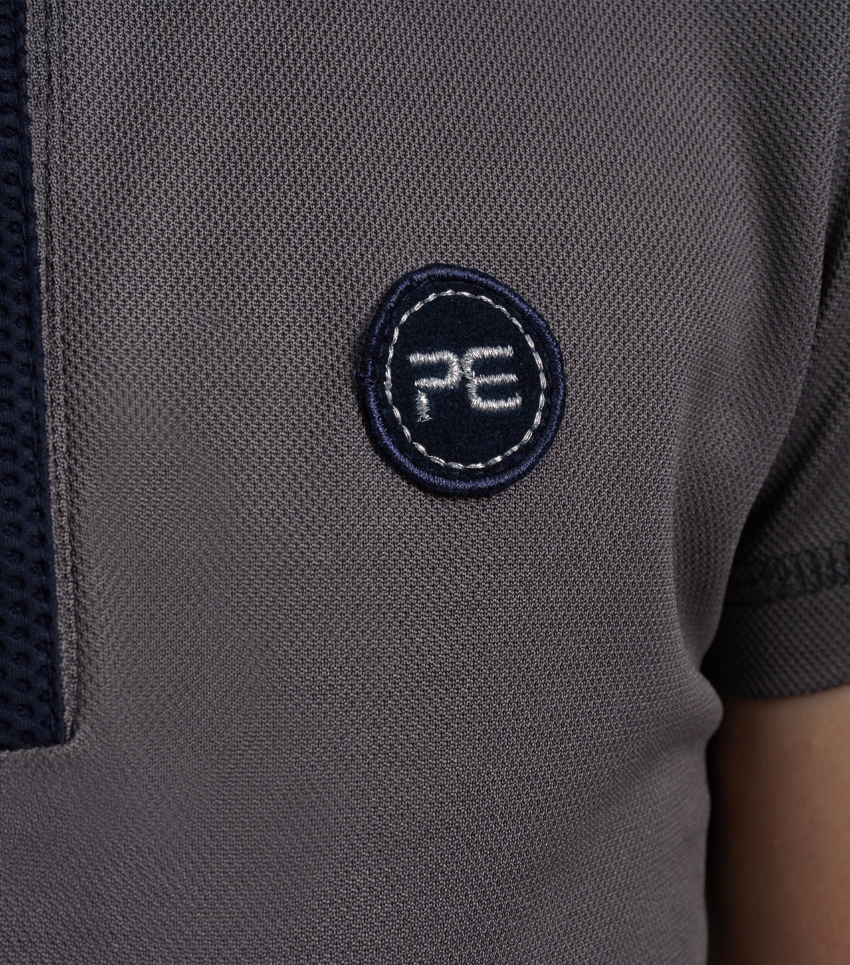 Premier Equine polo shirt, grey technical riding top for girls with logo. Performance apparel for equestrian activities.