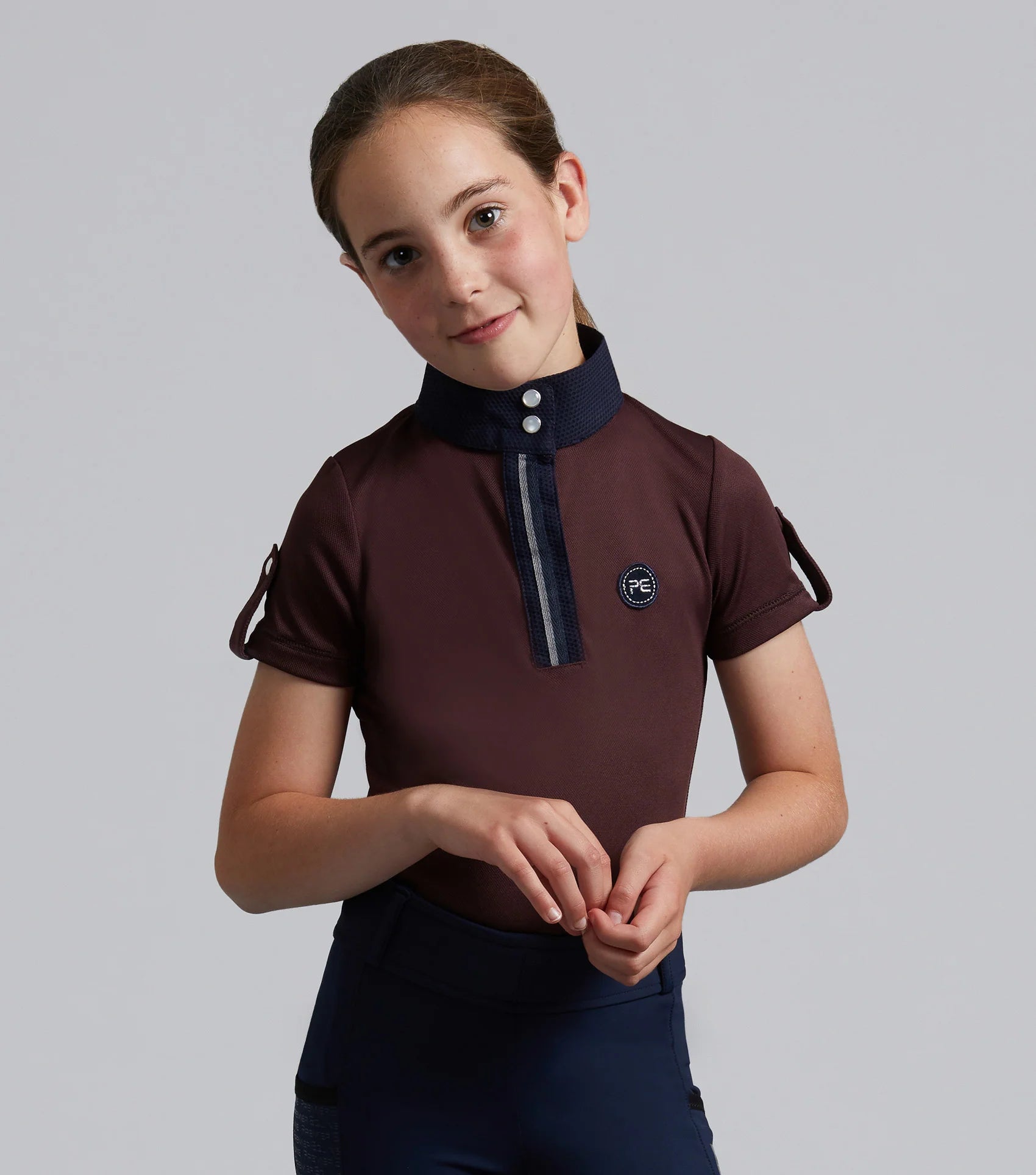 Premier Equine Mini Amia Girl's Riding Top in Wine. Equestrian apparel, technical short sleeve shirt.