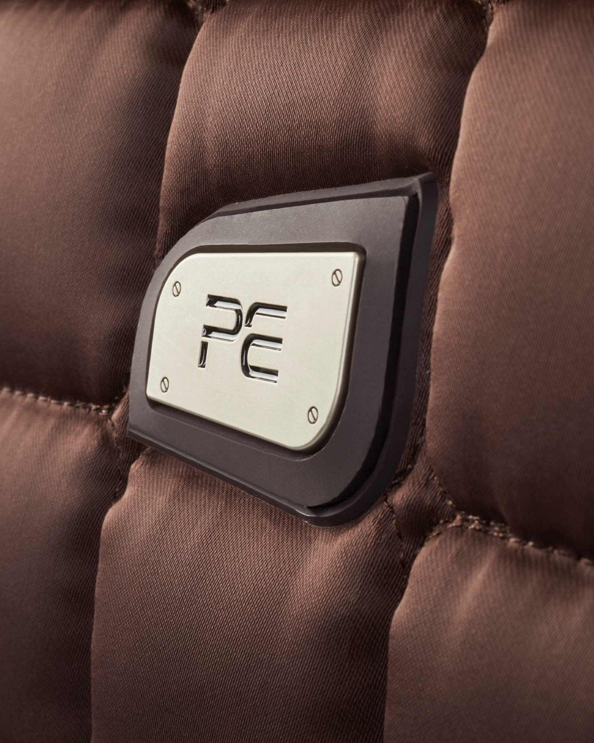 Premier Equine Armada Brown Dressage Saddle Pad Close Up with Logo Detail | High Quality Equestrian Equipment