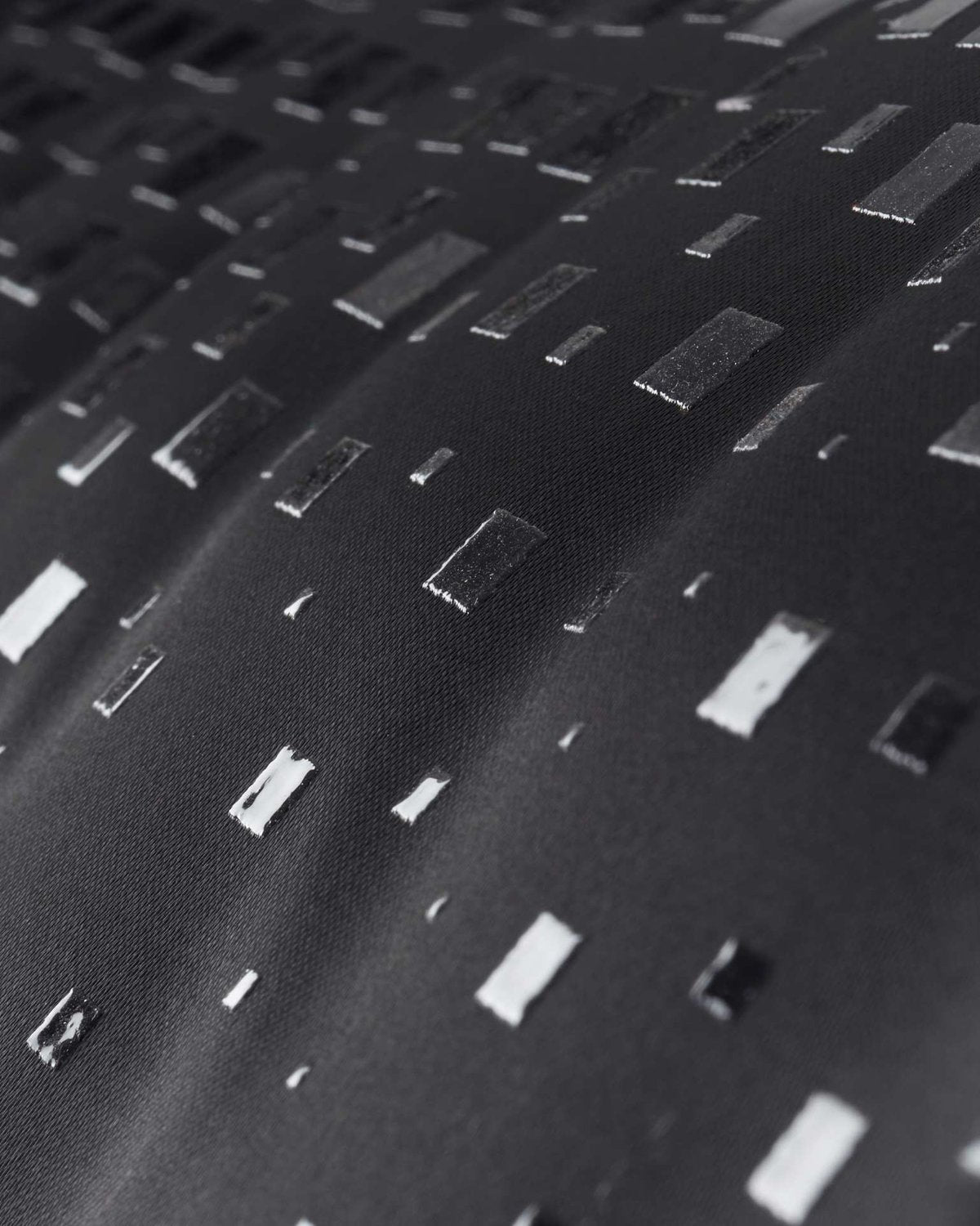 Black Quilted Dressage Saddle Pad: Close-Up of Luxe Satin Texture & Pattern, Equiflair