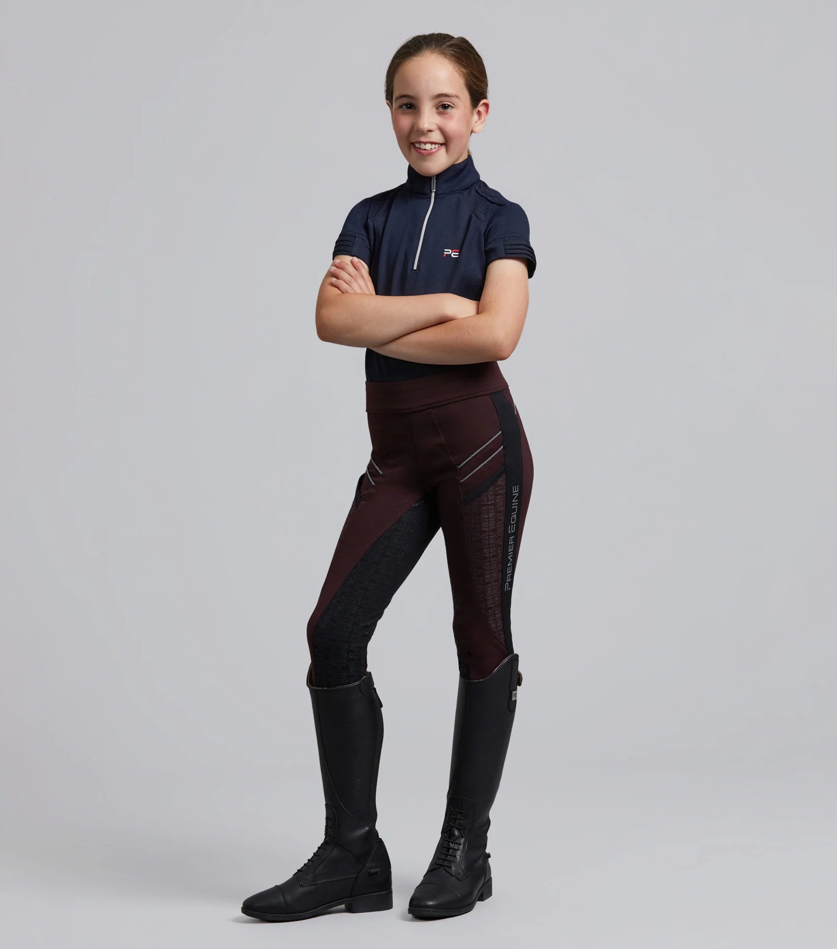 Girl in Premier Equine Astrid Riding Tights: Full Seat Gel, Pull-On, Wine Color, Equestrian Apparel