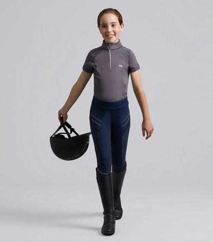 Girl in Premier Equine Navy Riding Tights: Gel Full Seat Equestrian Apparel for Kids, Horse Riding Fashion.