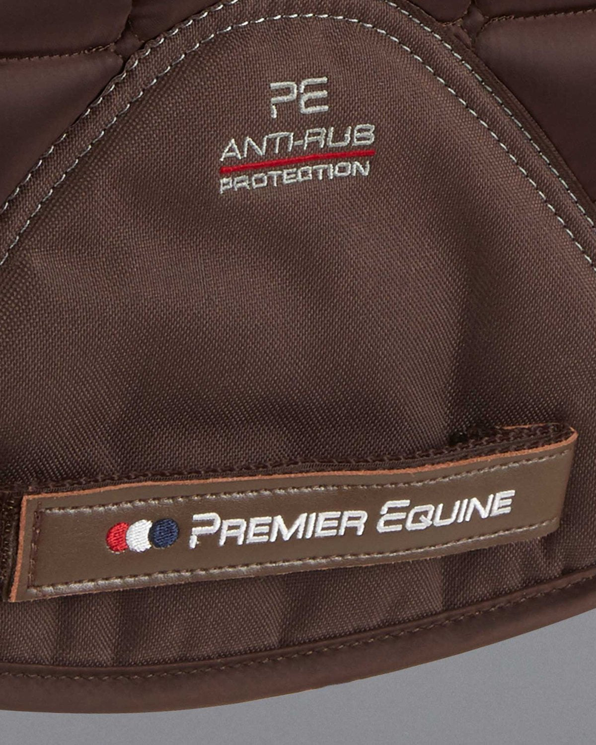 Premier Equine brown dressage saddle pad with Merino wool lining