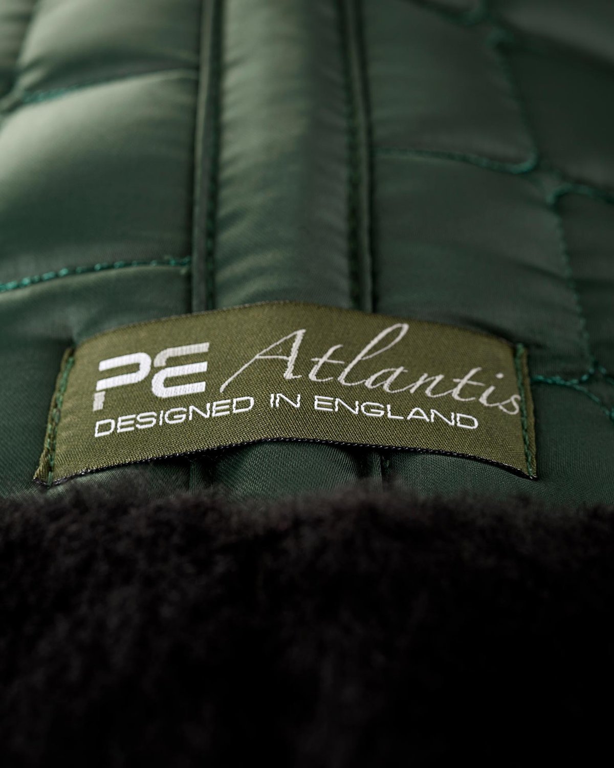 Premier Equine Atlantis Dressage Saddle Pad - Olive Satin & Black Wool. Designed in England. Equestrian comfort.