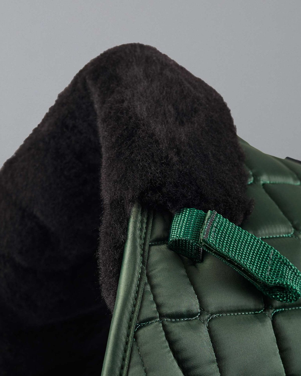 PREMIER EQUINE Atlantis Olive/Black Wool GP/Jump Saddle Pad by Equiflair. Quilted satin close up view