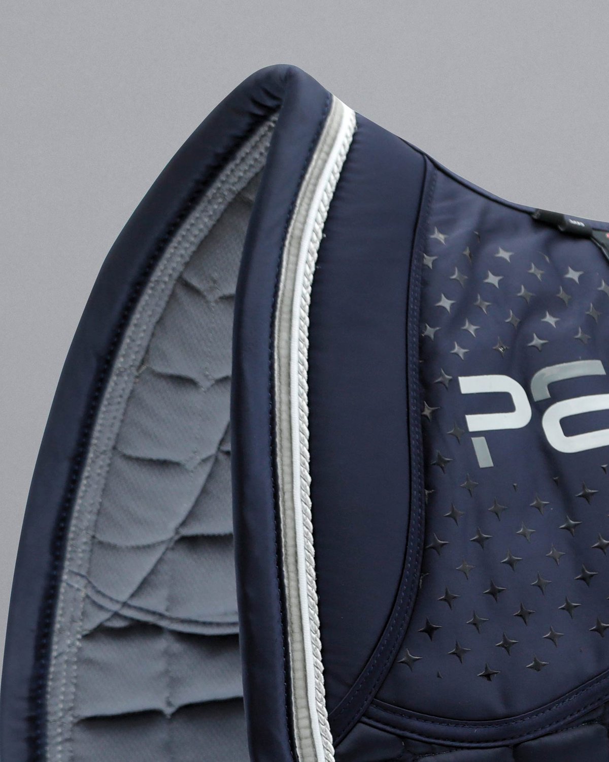 PREMIER EQUINE Azzure Anti-Slip Satin Dressage Square Navy Saddle Pad - Close-up view of luxurious design and technical features.