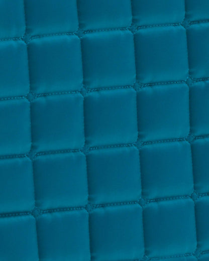 Turquoise Quilted Dressage Saddle Pad: Satin Anti-Slip Close-Up | Premier Equine Style