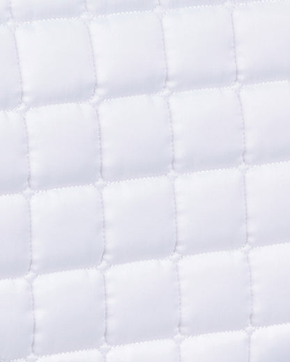 Premier Equine White Quilted Dressage Saddle Pad - Anti-Slip Tech Grip. Luxurious and functional equestrian accessory.