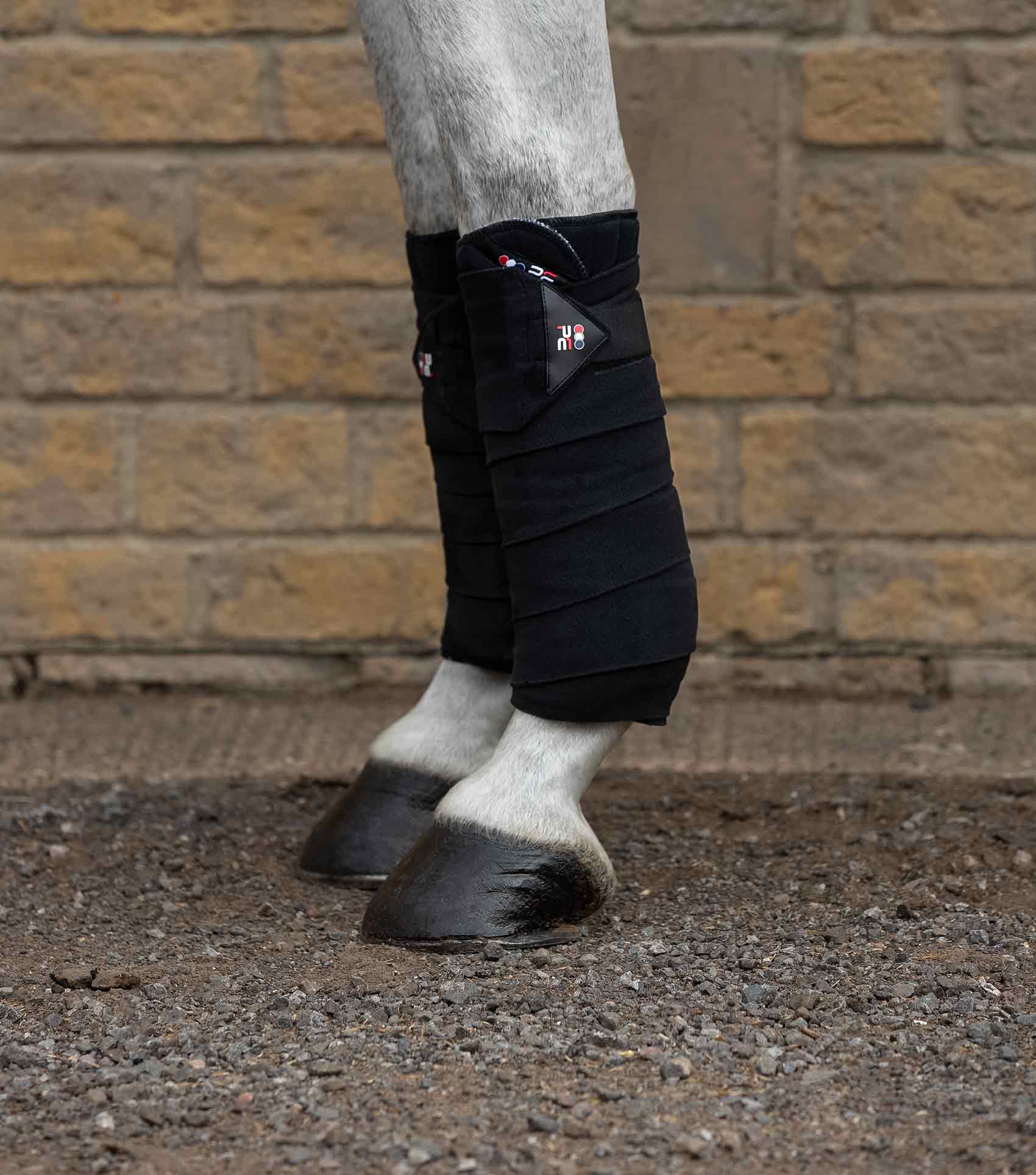 Horse Leg Wraps: Black Bandage Pads. Equine Comfort and Support for Training & Riding.
