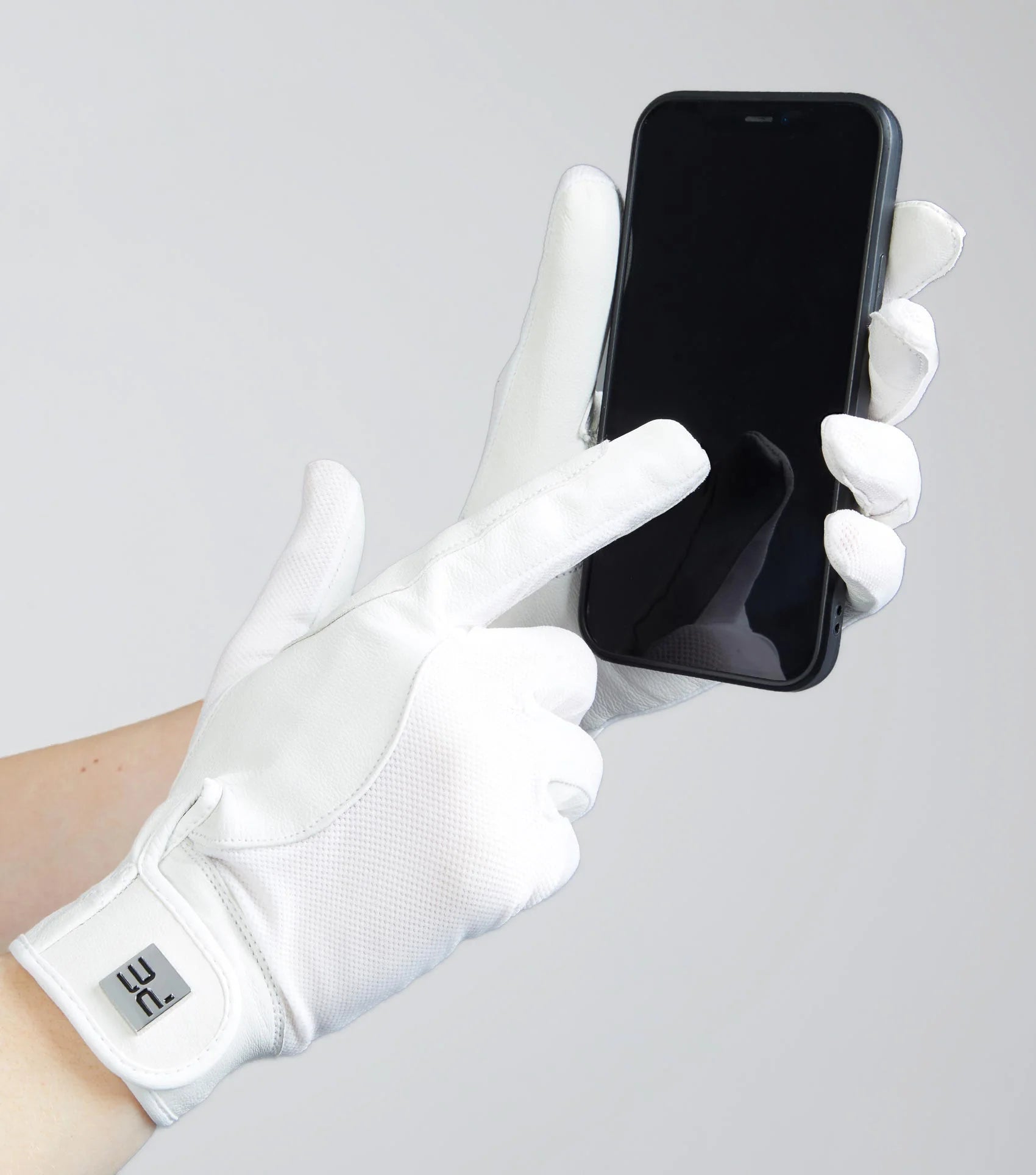 Premier Equine White Riding Glove Touchscreen Compatible. Leather Mesh equestrian glove using smartphone